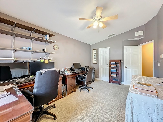 carpeted office with vaulted ceiling and ceiling fan