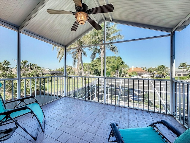 sunroom / solarium with vaulted ceiling and ceiling fan