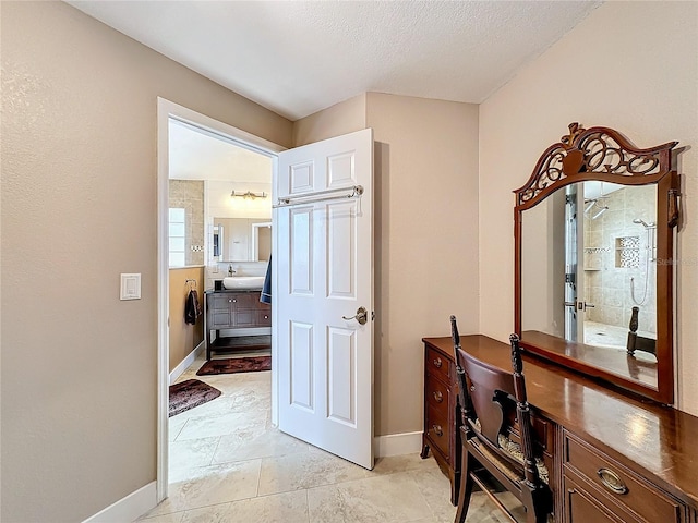 corridor with a textured ceiling