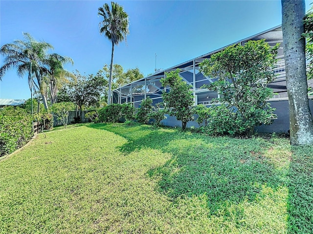 view of yard with a lanai