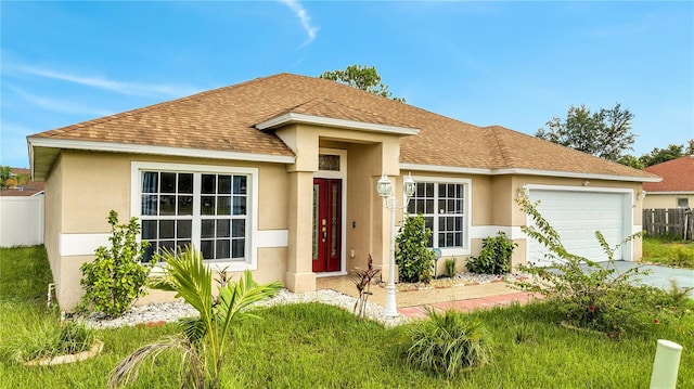 view of front of property with a garage