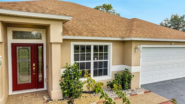 property entrance with a garage