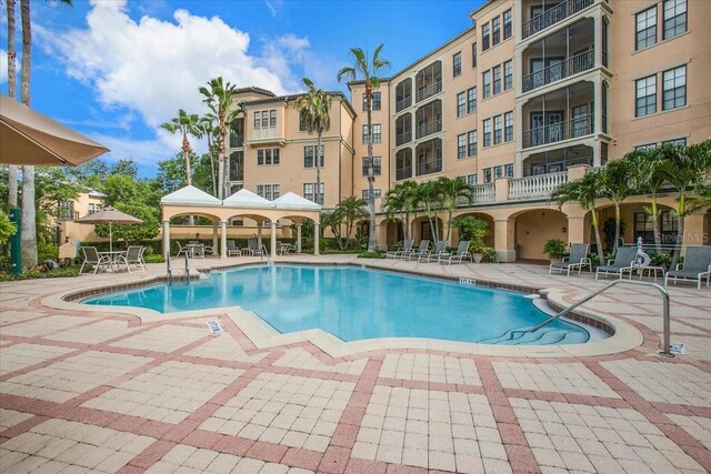 view of swimming pool with a patio and a gazebo