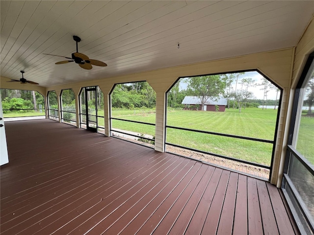 exterior space with a yard and ceiling fan