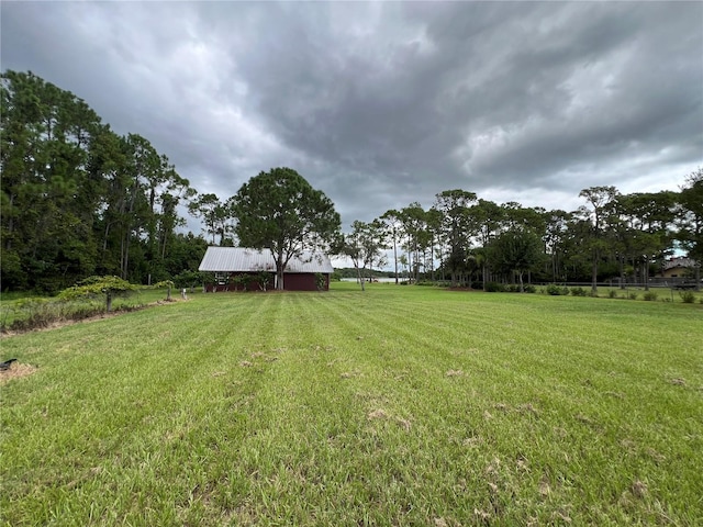 view of yard with a rural view