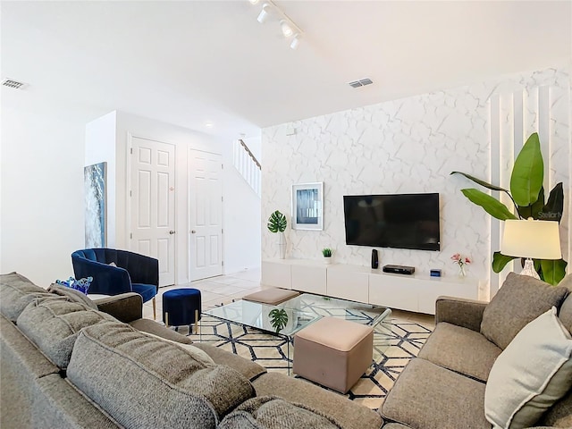 tiled living room with rail lighting