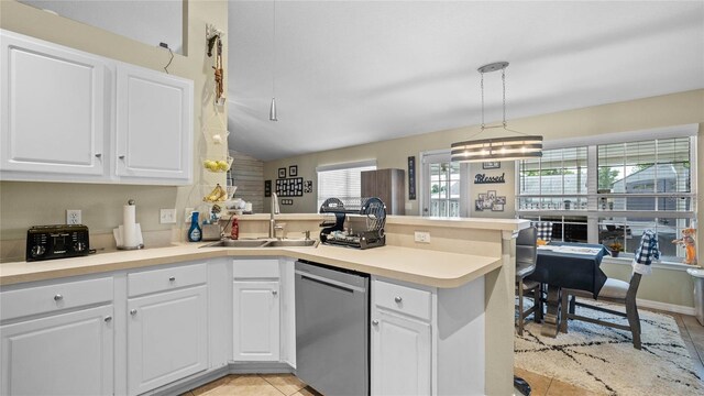 kitchen featuring white cabinetry, decorative light fixtures, dishwasher, kitchen peninsula, and light tile patterned flooring