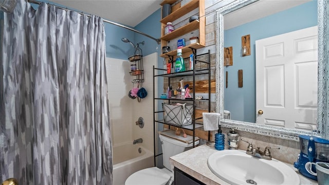 full bathroom featuring toilet, shower / tub combo with curtain, a textured ceiling, and vanity