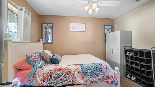 carpeted bedroom with ceiling fan