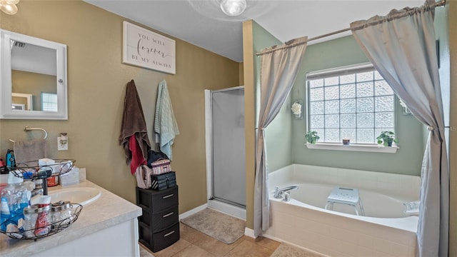 bathroom featuring vanity, independent shower and bath, and tile patterned floors