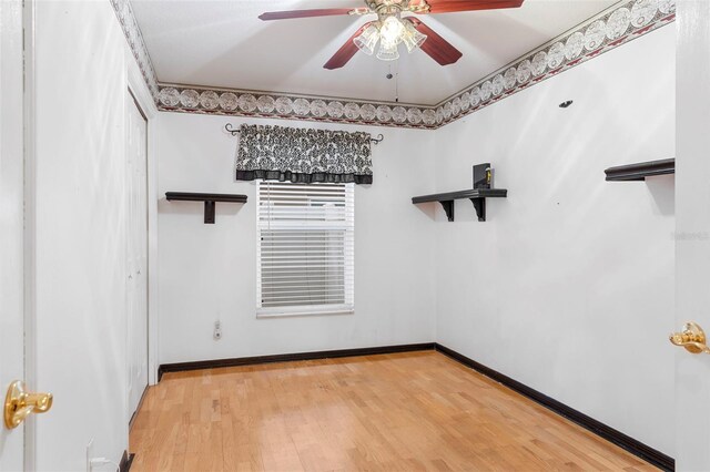 unfurnished room featuring ceiling fan and hardwood / wood-style flooring