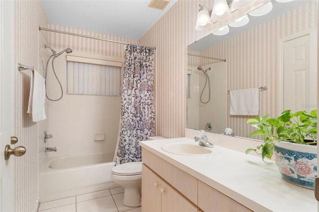 full bathroom featuring shower / bath combination with curtain, tile patterned flooring, vanity, and toilet