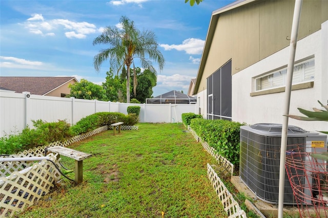 view of yard featuring central AC