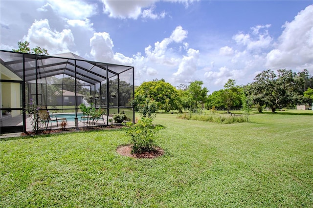 view of yard with glass enclosure