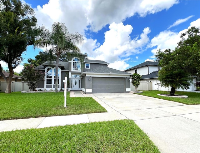 view of front of property with a garage and a front yard