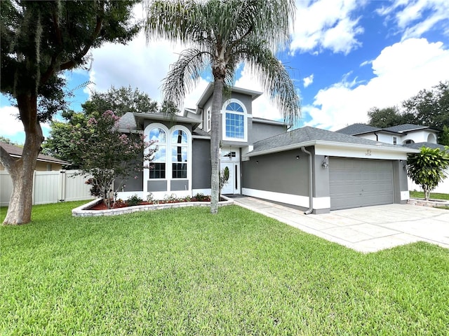 view of front of home with a garage and a front yard