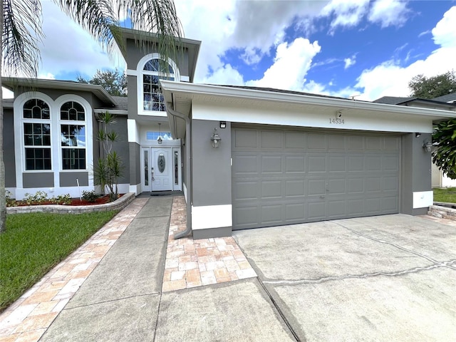 view of front of home with a garage