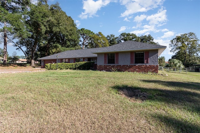 single story home with a front yard