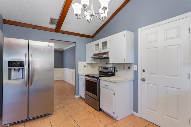 kitchen with appliances with stainless steel finishes, pendant lighting, an inviting chandelier, vaulted ceiling with beams, and white cabinetry