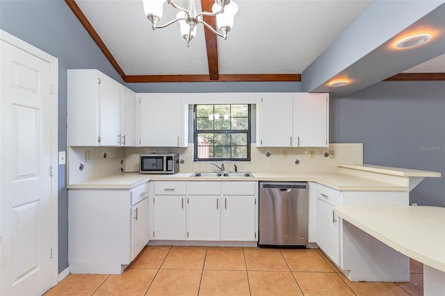 kitchen featuring a sink, light tile patterned floors, backsplash, and stainless steel appliances