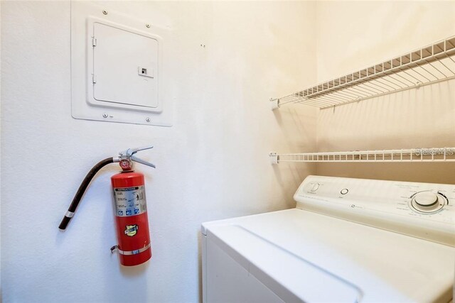 clothes washing area with washer / clothes dryer