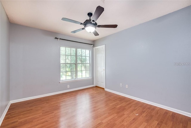 empty room featuring light hardwood / wood-style flooring and ceiling fan