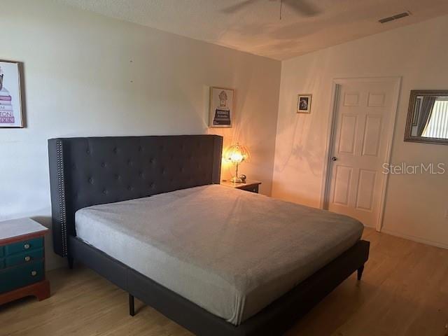 bedroom featuring ceiling fan and wood-type flooring