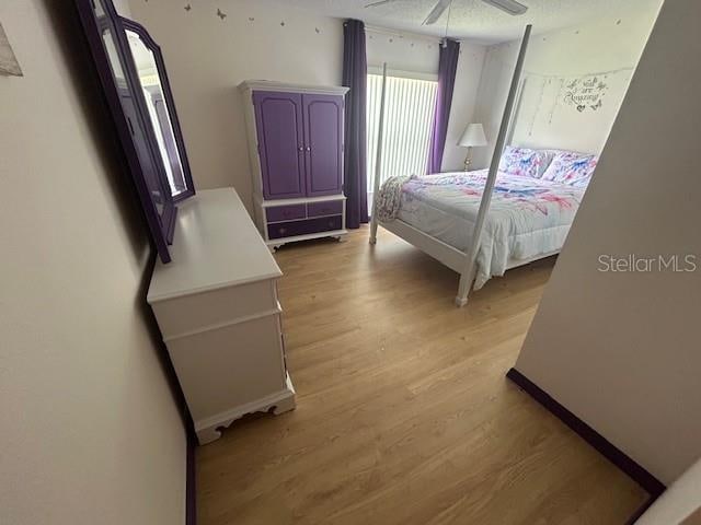 bedroom featuring ceiling fan and light hardwood / wood-style floors