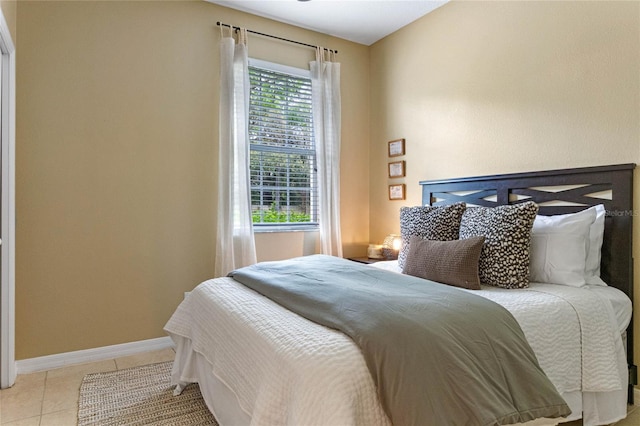 bedroom featuring light tile patterned floors