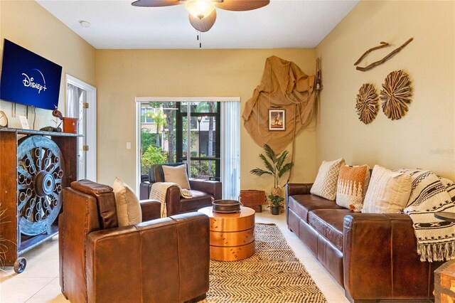 living room featuring tile patterned flooring and ceiling fan