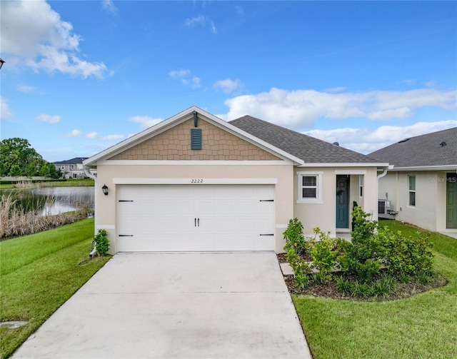 ranch-style house with a front yard and a garage