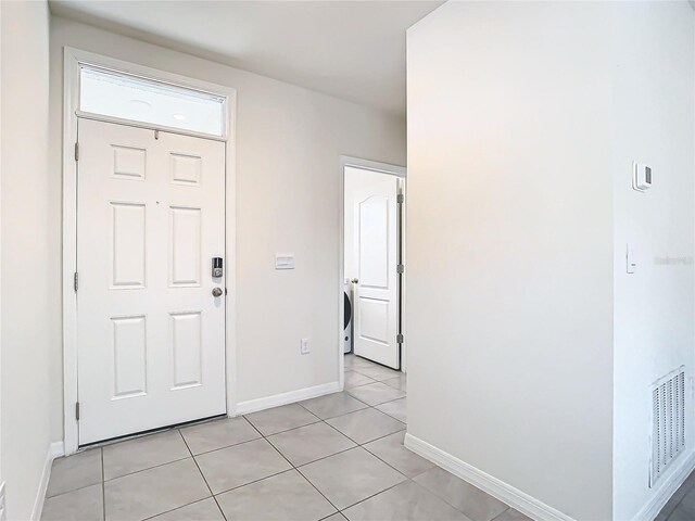 view of tiled foyer entrance