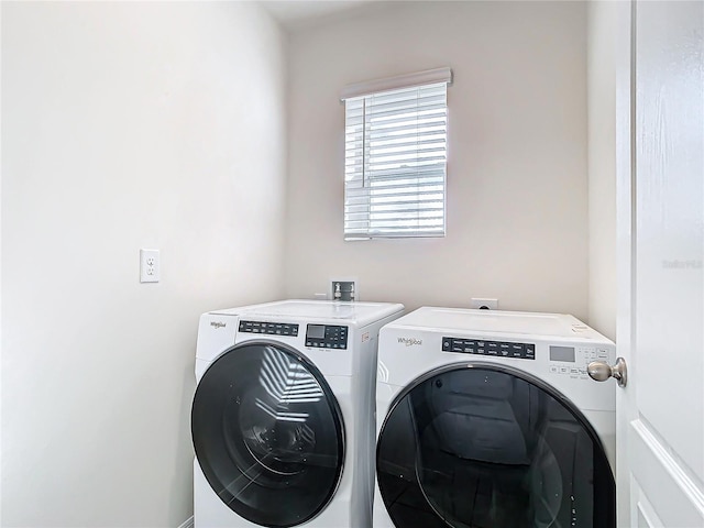 laundry area with separate washer and dryer