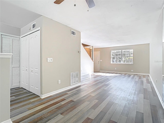 interior space featuring visible vents, ceiling fan, and wood finished floors