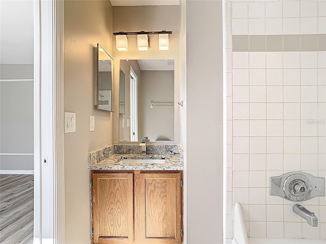 bathroom featuring shower / tub combination and vanity