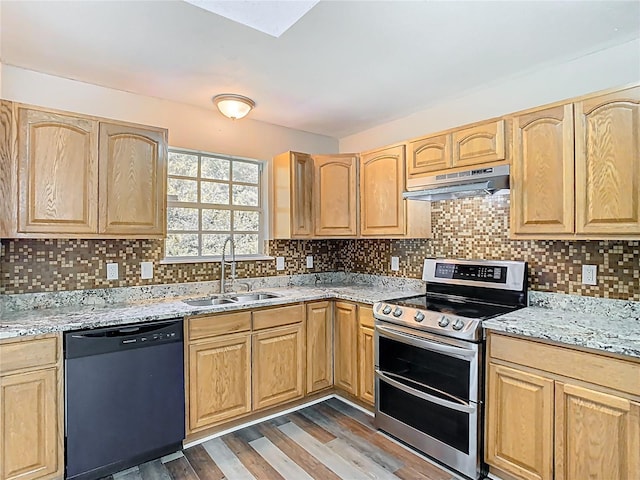 kitchen featuring double oven range, light brown cabinetry, a sink, under cabinet range hood, and dishwasher