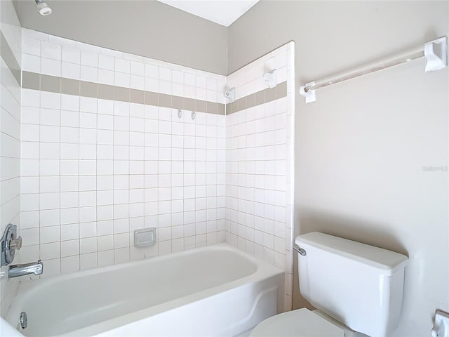 bathroom with toilet and shower / washtub combination