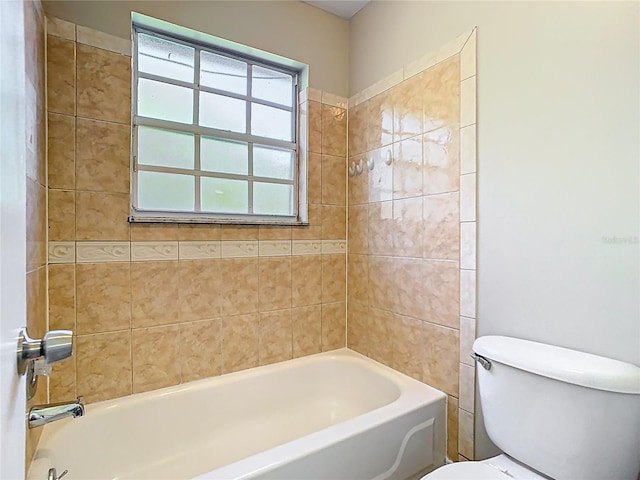 full bathroom featuring toilet and washtub / shower combination