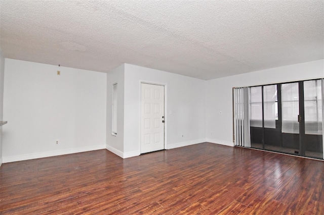 954 Courtyard Ln Unit 11, Orlando, FL 32825 - empty room with a textured ceiling, wood finished floors, and baseboards