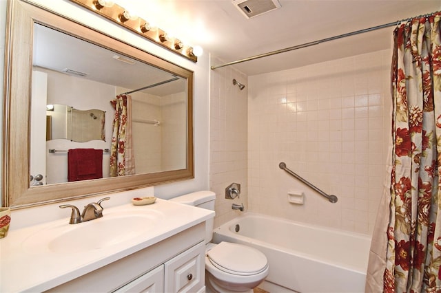 full bathroom featuring vanity, shower / bath combo with shower curtain, and toilet