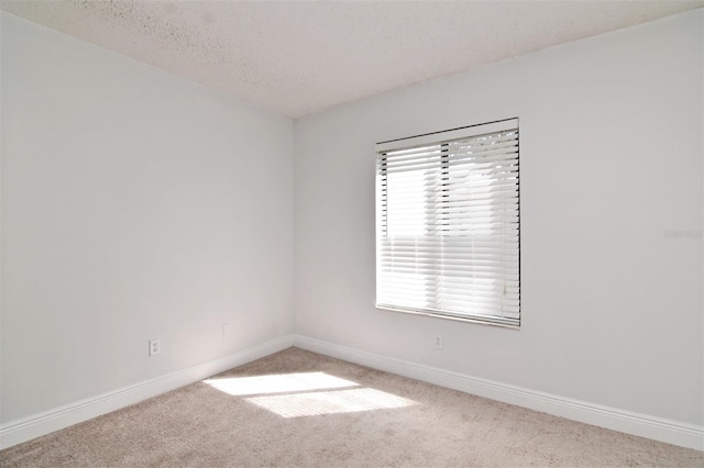 954 Courtyard Ln Unit 11, Orlando, FL 32825 - carpeted spare room featuring a textured ceiling and baseboards