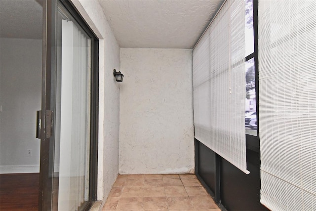 954 Courtyard Ln Unit 11, Orlando, FL 32825 - hall featuring a textured ceiling