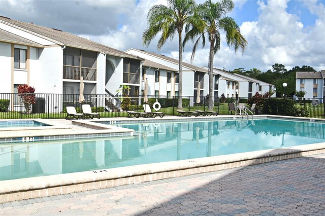 view of pool featuring a hot tub