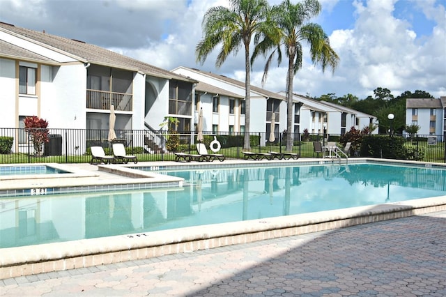 954 Courtyard Ln Unit 11, Orlando, FL 32825 - community pool featuring a residential view and fence