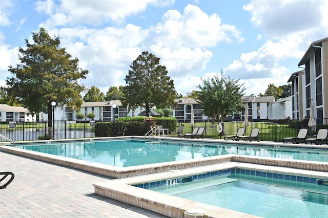 954 Courtyard Ln Unit 11, Orlando, FL 32825 - community pool with fence and a residential view
