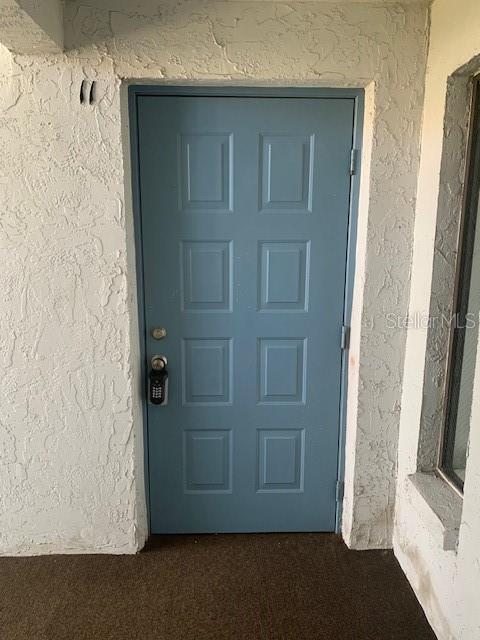 954 Courtyard Ln Unit 11, Orlando, FL 32825 - entrance to property with stucco siding
