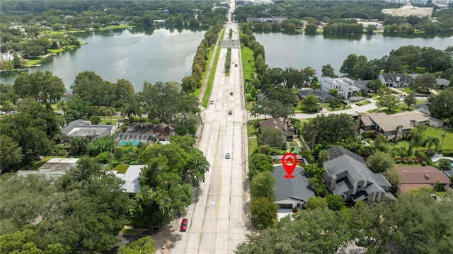birds eye view of property with a residential view and a water view