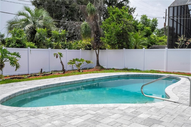 view of pool with a fenced backyard, a fenced in pool, and a patio area