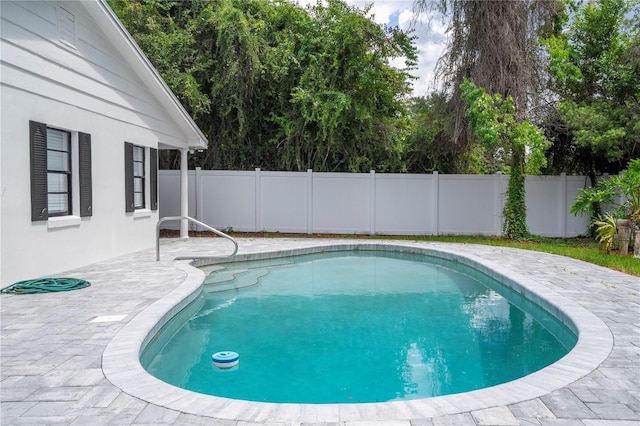 view of pool with a patio, a fenced in pool, and a fenced backyard