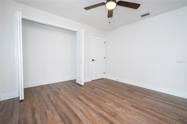 unfurnished bedroom with a ceiling fan, wood finished floors, baseboards, and visible vents